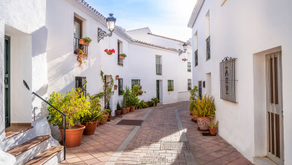 Whitewashed homes line narrow alleys in Marbella, one of the best vacation spots for couples. 
