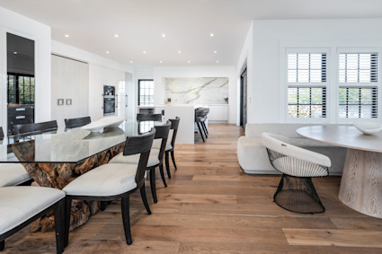 This bright, coastal-inspired dining space at Cedar Isle in Cape Cod is ideal for summer seafood feasts and relaxed gatherings, surrounded by natural light and sophisticated finishes.