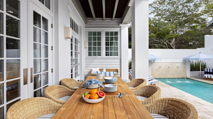 An elegant outdoor patio set for a gourmet summer feast, evoking the allure of private chef events in luxury Pacaso homes.