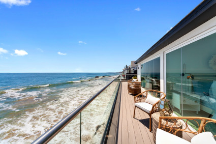 malibu balcony overlooking ocean with deck chairs