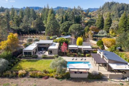 The Hollow aerial three buildings and a pool