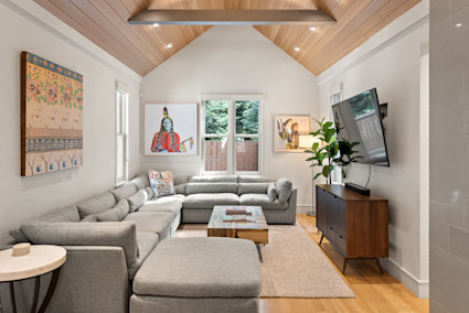 Aspen Peak's vaulted living room and media space set the tone for post-ski gatherings, from board games to movie nights by the fire.