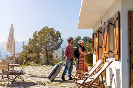 Young couple arriving at a vacation home