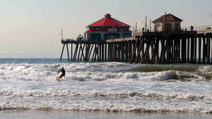A photo of someone surfing, one of the many empty nest ideas to try.