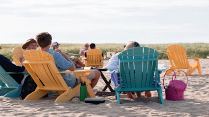Cape Cod beach scene that reflects the relaxed, social summer pace that makes Cape Cod vacation homes so appealing.