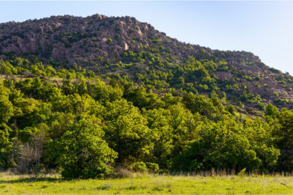 An image of the Wichita Mountains shows one of the many mountain getaways in Oklahoma. 