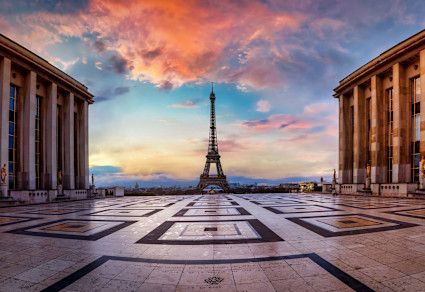 A stock photo shows the courtyard between two buildings in Trocadéro, with the Eiffel Tower in the distance.