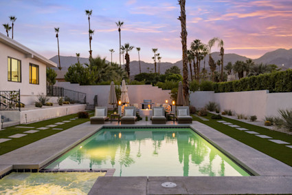 A modern pool and spa with mountain views at a Pacaso home in Palm Desert, showcasing desert modernism and outdoor living.