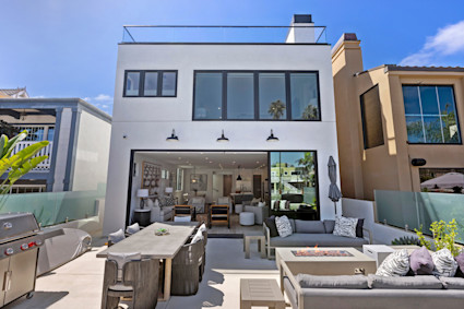 Waterside in Newport Beach offers bay-view outdoor living and a patio with fireplace, perfect after harbor cruises and beach days.