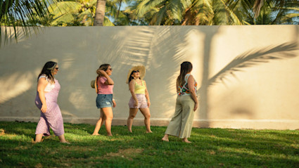 A group of friends enjoying the sunny, stylish Newport Beach atmosphere, capturing the vibrant social energy of the film festival.