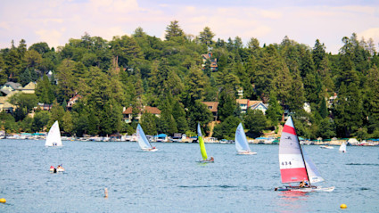 Sailboats on Lake Arrowhead during the quieter months, a calm backdrop for slow-season living and lakefront ownership.