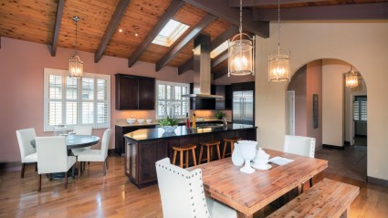 home with arched windows and wood beam ceilings 