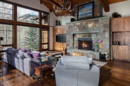 Rustic living room with a stone fireplace