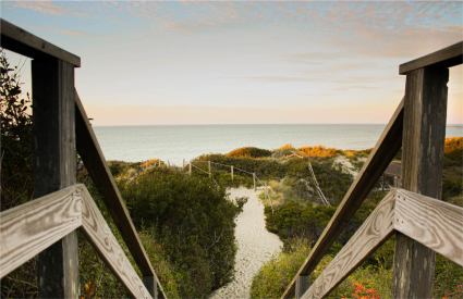 A stairway leads you down a Nantucket beach path.