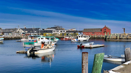 Calm harbor waters capture the island’s refined pace, perfect for slow mornings and evening strolls.