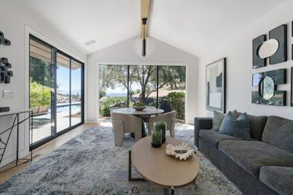The luminous great room at Infinite Road, with its soaring ceilings and vineyard views, captures the sense of calm and open space that defines summer living in Napa Valley.