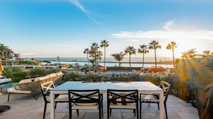 Orange County patio at sunset, a natural backdrop for dockside seafood and fall entertaining.