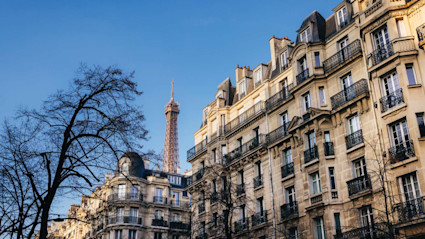 Image of a luxury apartment in Paris with the Eiffel Tower in the background. 