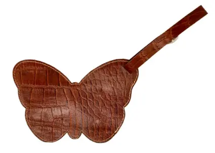 a brown leather butterfly shaped luggage tag