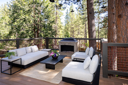 wooden deck with an outdoor living space at 735 Betty Lane, Incline Village, NV 89451, showcasing a serene mountain setting