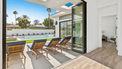 sliding glass doors with lounge chairs for indoor outdoor living