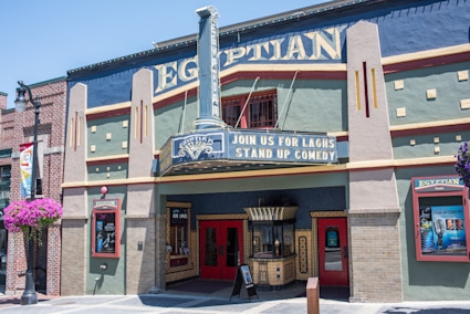 The iconic Egyptian Theatre on Park City's Main Street, adorned with its colorful Art Deco facade and marquee, highlights the heart of the Sundance Film Festival and the vibrant cultural scene of Park City, Utah.