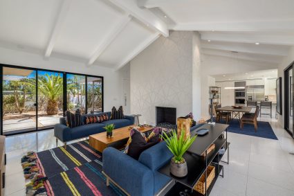 Living room with vaulted ceilings and blue furniture