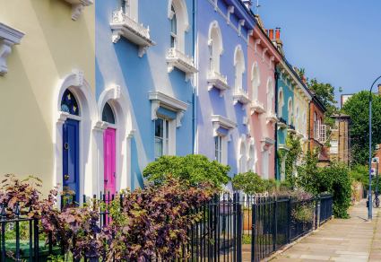 A row of colorful houses line the streets of Notting Hill in London. 