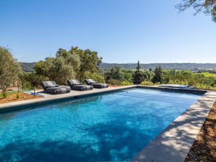 Outdoor pool with lounge chairs