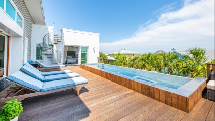 Deck with pool and palm trees