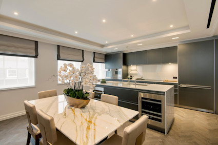 Queen Street Penthouse in Mayfair illustrates turnkey London living with bright interiors, parquet flooring and an entertainer friendly dining space.