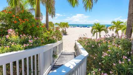 A boardwalk leads to the white sand beach of St. Petersburg, one of the best spring break ideas for families.