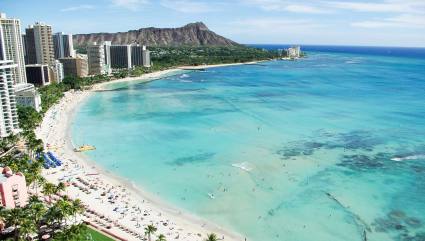 An aerial view of Waikiki’s clear waters showcase what makes it one of the best beaches for kids in the country.  