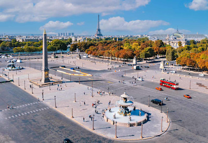 A photo shows the streets of Madeleine with the Eiffel Tower in the distance.