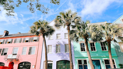 Historic buildings and palm trees in Charleston, South Carolina, set the tone for a blend of tradition and upscale coastal living.