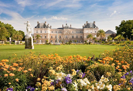 A stock photo shows a castle surrounded by flowers at St. Germain des Prés.