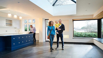 Family touring a home they found on a Zillow alternative like Pacaso. 