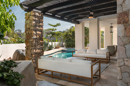 Esperanza’s pergola, fans and pool with connected hot tub show how shade and water features extend winter outdoor living.