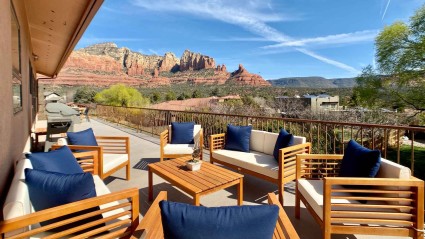 Outdoor vacation home patio with chairs overlooking majestic red rock mountains of Sedona