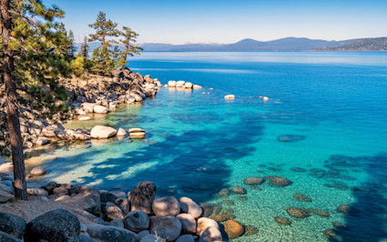 Lake Tahoe’s sapphire waters meet rocky shores and pine forests, securing its place among the most beautiful places in the US.