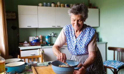 A person mixes batter in a bowl while exploring what to do after retirement.
