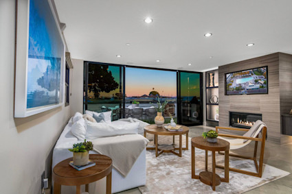 Sunset Bay's window-wrapped great room and multiple decks offer natural zones for friendly tournaments and group mixers in San Diego.