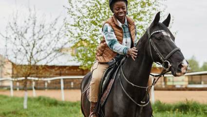 A person riding a horse at Steamboat Ski resort, one of the top Steamboat Springs summer activities.