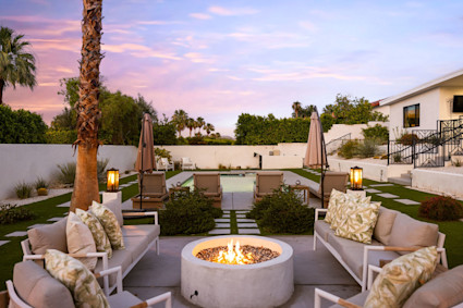 Palm Desert patio with fire feature and dining captures the 2025 trend for comfortable, lighted outdoor lounges.