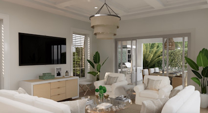 Light-filled living room with white furnishings, coffered ceilings, and French doors opening to the patio.