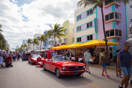 People walking down Ocean Boulevard during Art Deco Weekend in Miami.