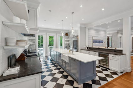 Kiawah Island kitchen with island and open shelving supports high capacity hosting and smooth indoor outdoor service.