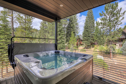 Jasper's private deck and hot tub offer a relaxing reset after lake days filled with kayaking or paddleboarding.