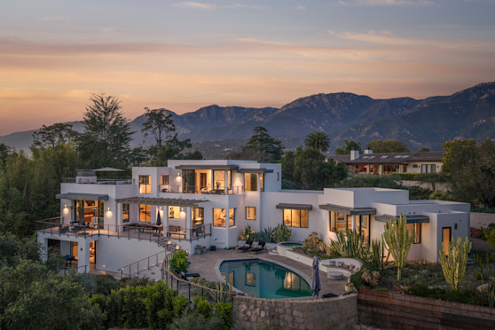 Riviera, Pacaso home at 1131 Las Alturas Road, Santa Barbara — dusk aerial exterior with pool (DJI_2226, March 2026 shoot)