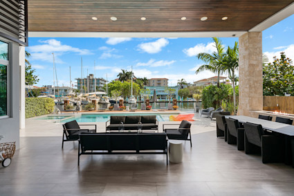 An outdoor lounge area and pool at Las Olas in Fort Lauderdale, showcasing the upscale coastal lifestyle on the Gold Coast.